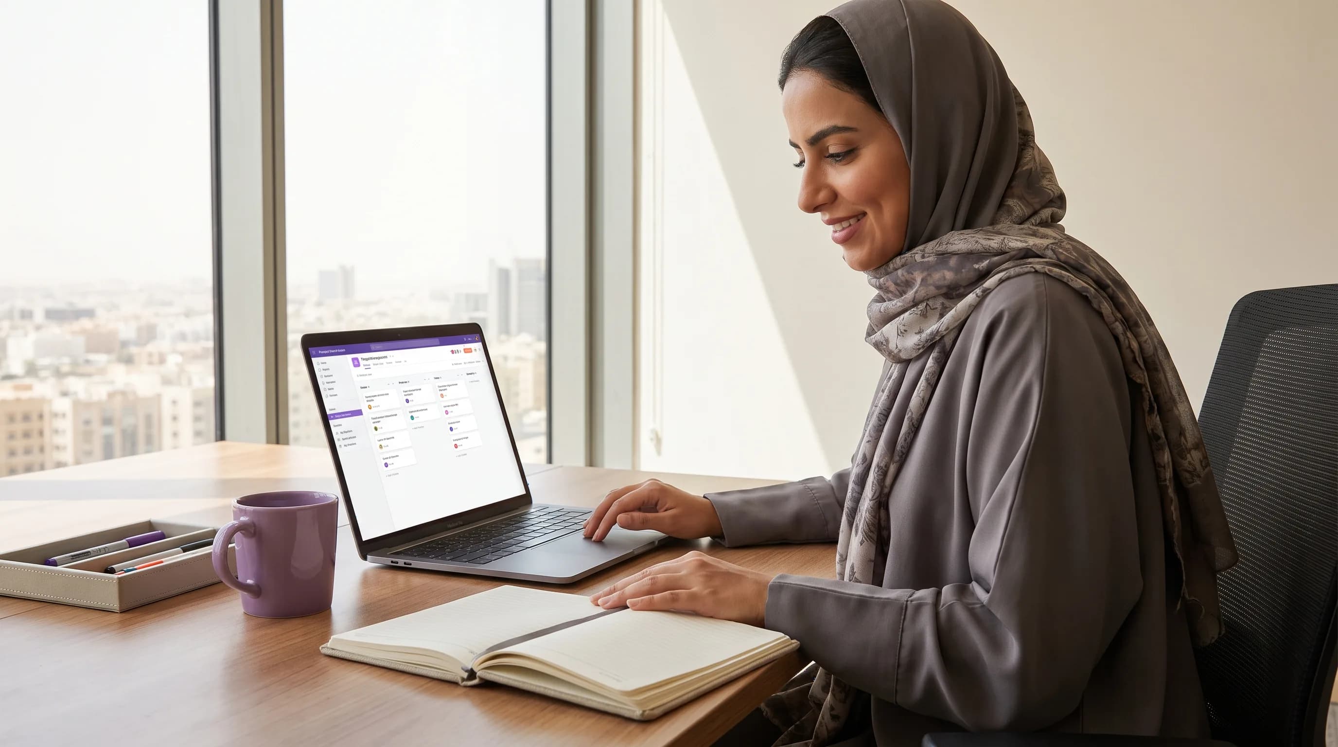 A professional organizes tasks in a notebook and a simple digital workspace on a laptop.